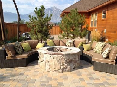 There is a fire pit in the middle of the patio.