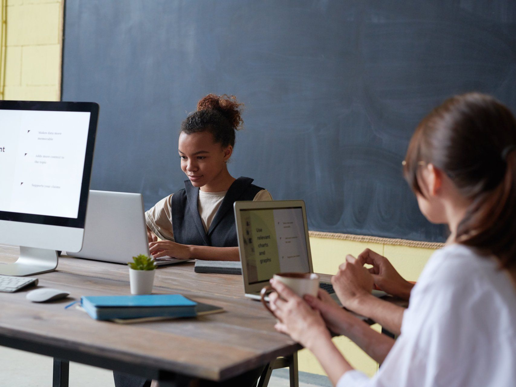 people working on their computers and laptops