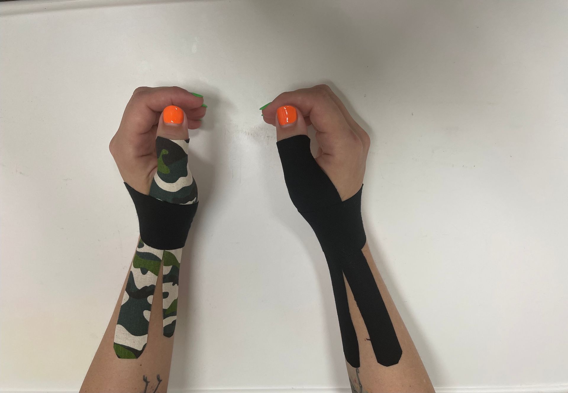 Two hands with Kinesiology tape — Occupational Therapist in Yeppoon, QLD