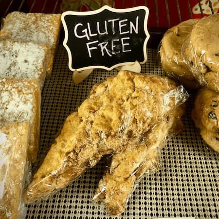 A display of gluten free baked goods on a table.