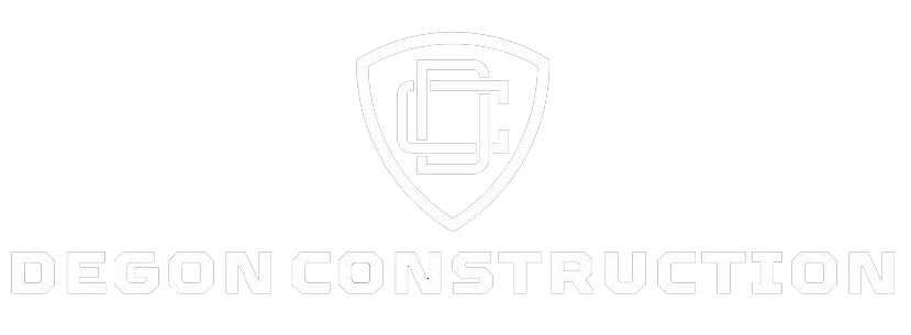 A white logo for Degon Construction featuring a shield icon with an intertwined "DC" monogram, against a black background.