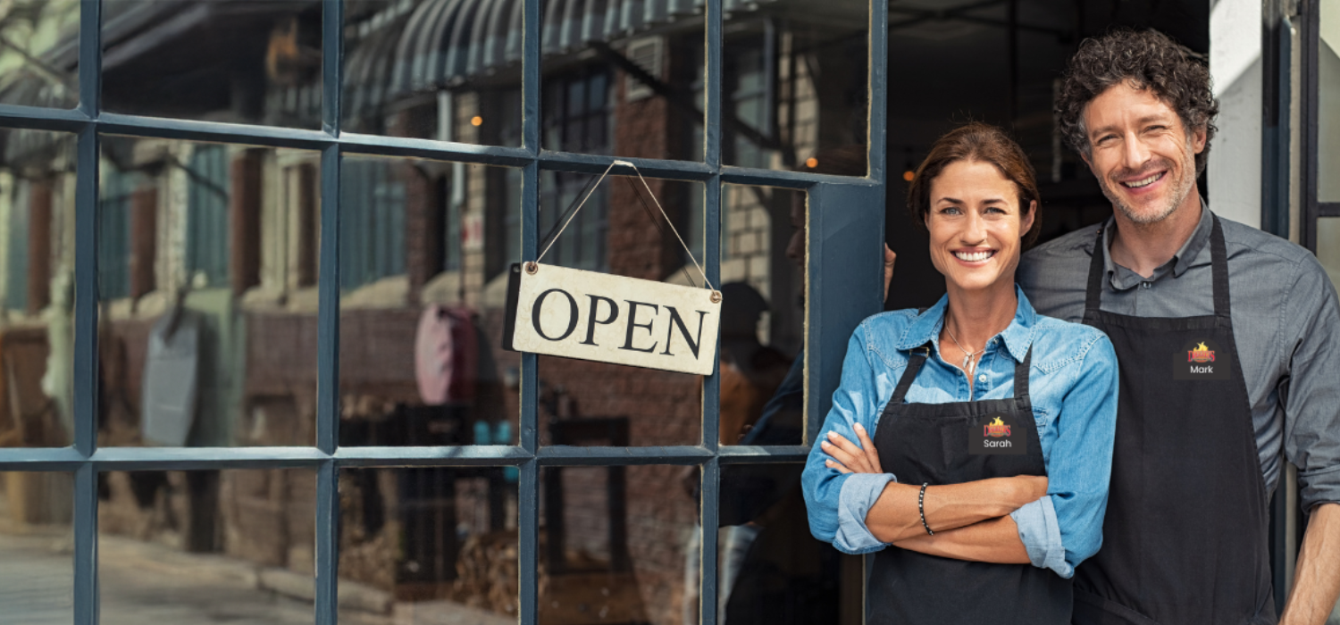 business owners wearing business name tags