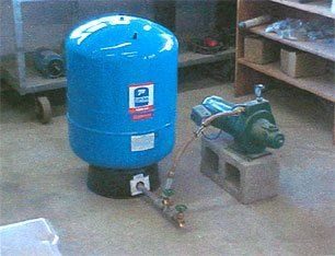 Tank Connected to a Pump — Houston, TX — Raymond Services Inc.