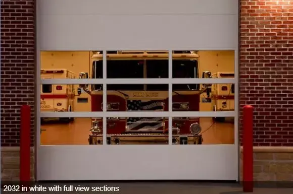 A fire truck is reflected in a white garage door