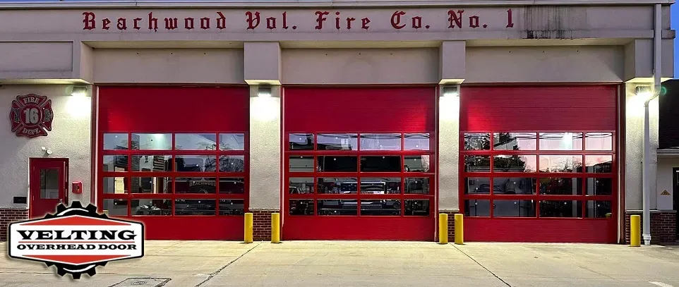 A fire station with red doors and a sign that says beachwood vol fire co. no. 1