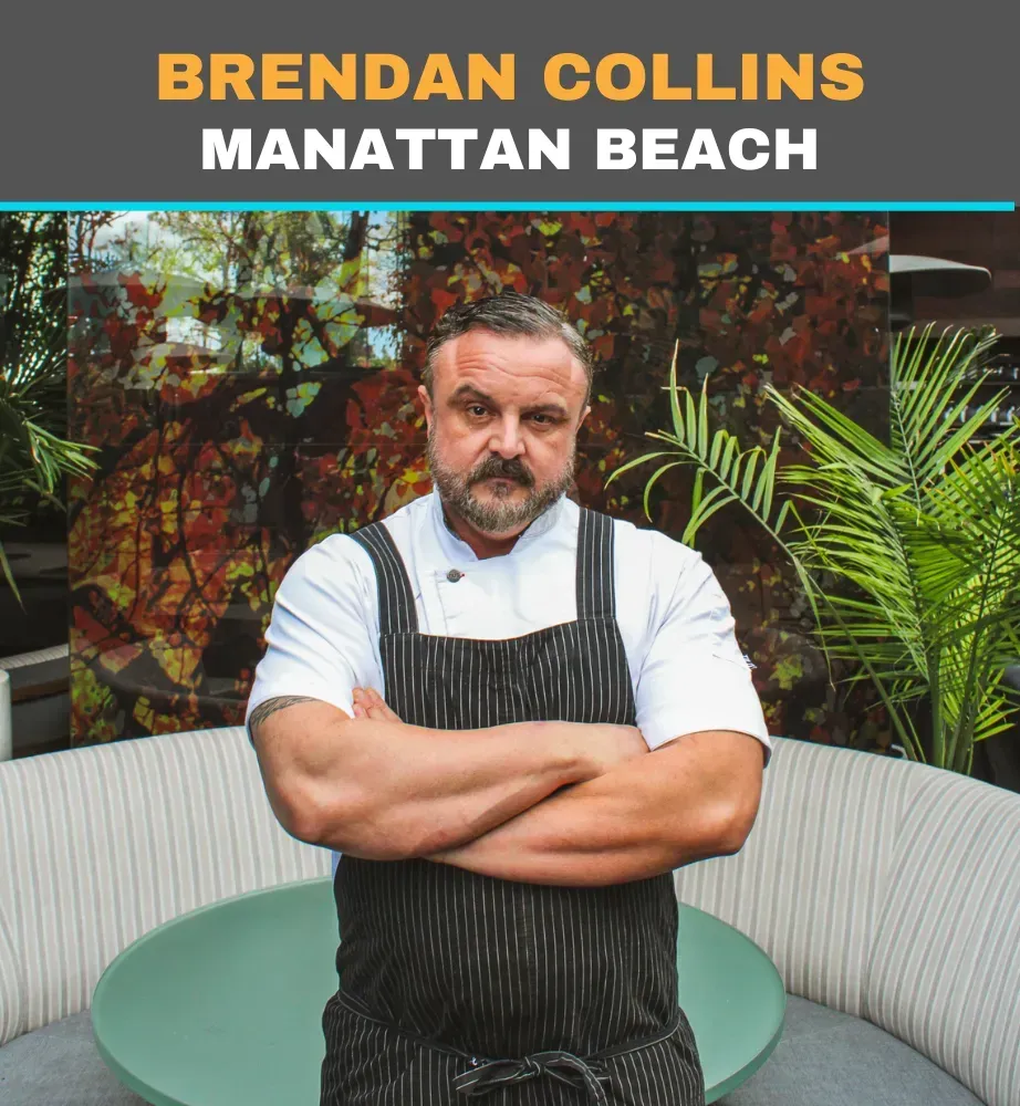 Brendan Collins in an apron stands with arms crossed on a patio at Manhattan Beach.