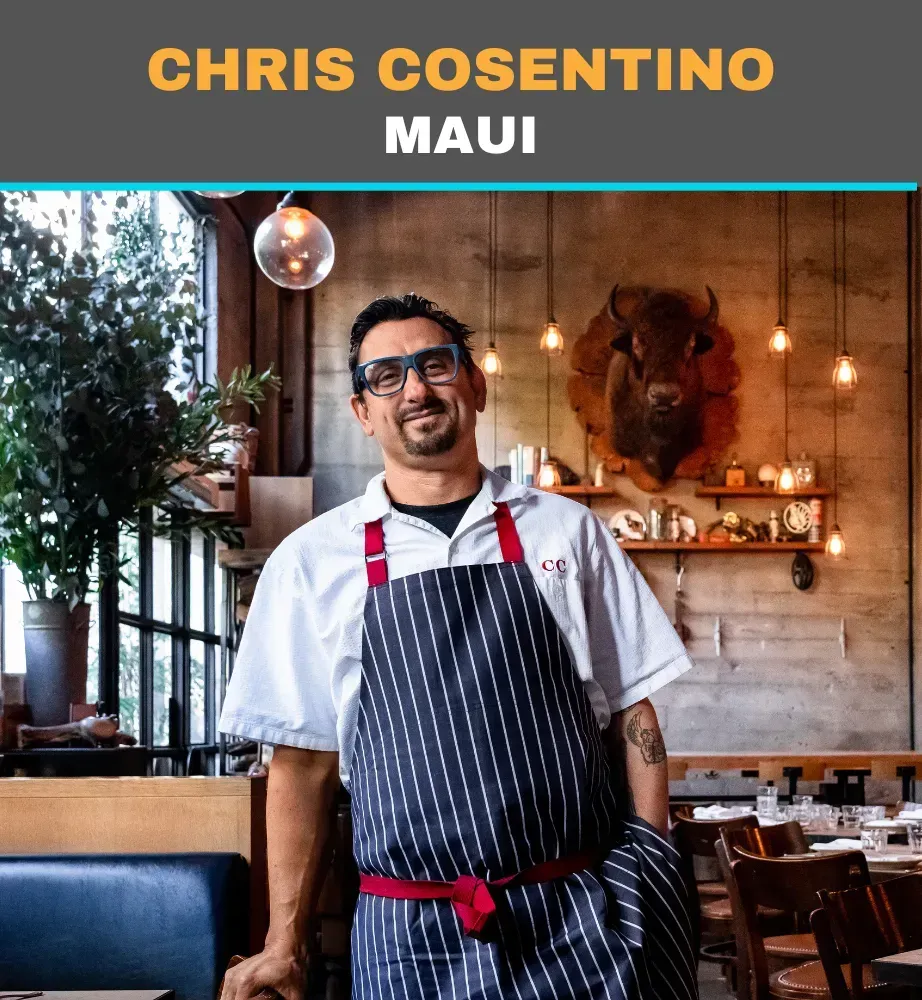 Chef in striped apron smiling in a warm restaurant interior, with “Chris Cosentino Maui” text above.