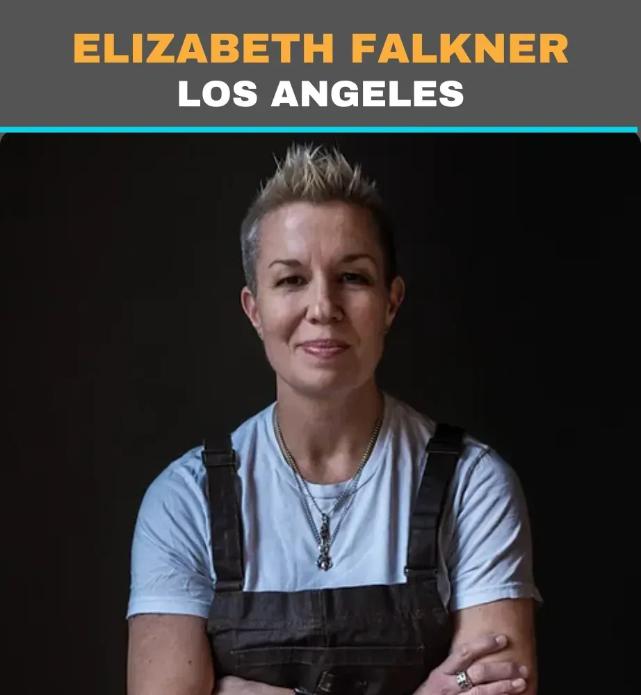 Elizabeth Falkner in Los Angeles, seated with folded arms against a dark background.