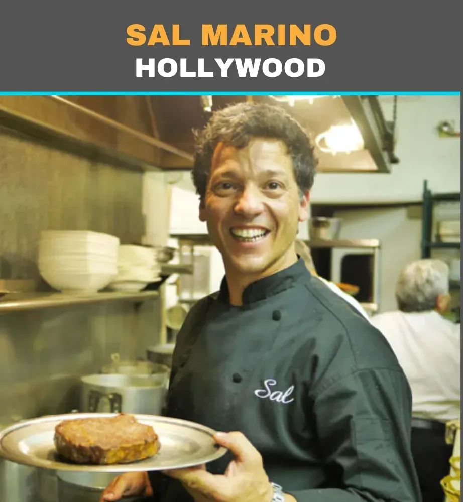 Sal Marino smiling in a restaurant kitchen, holding a plated dish, with “SAL MARINO HOLLYWOOD” text above