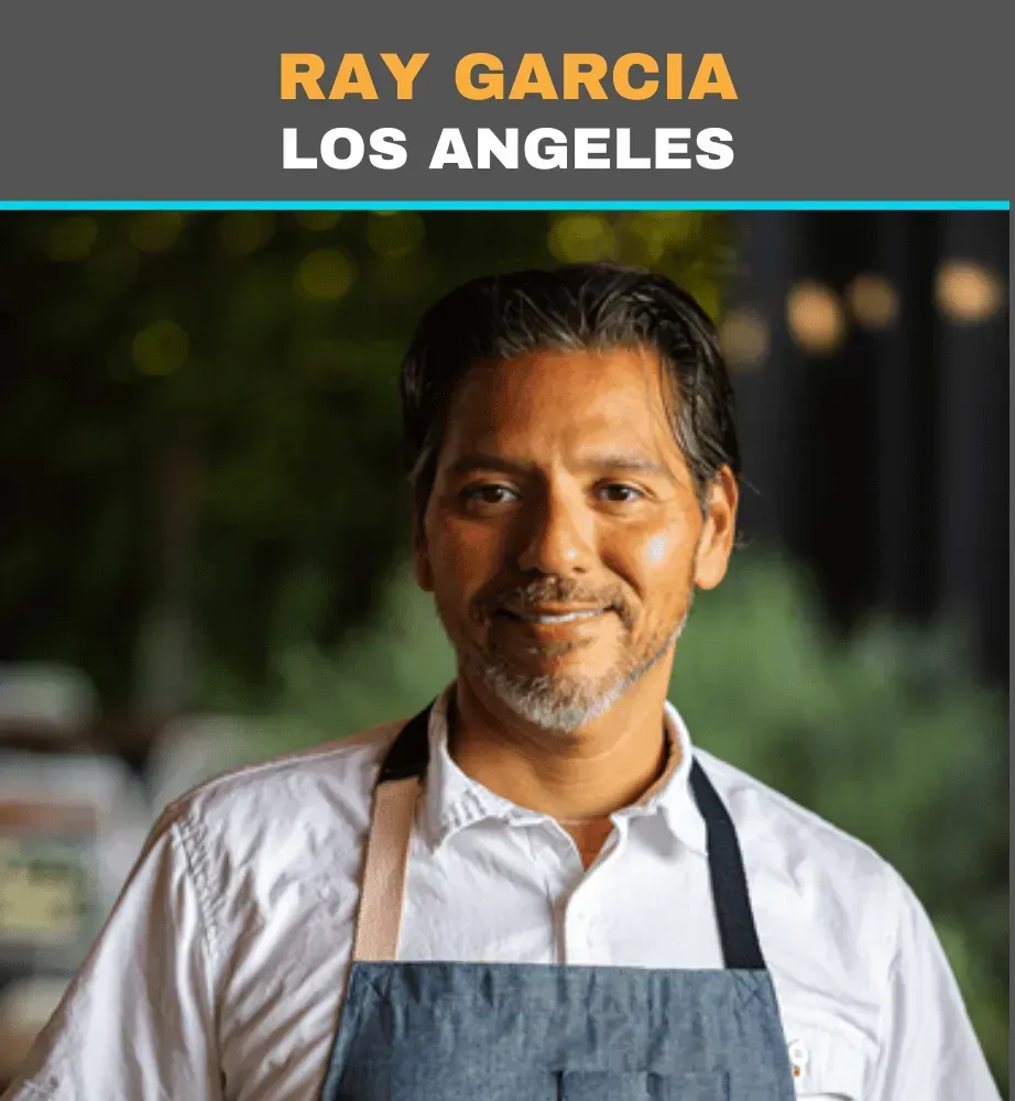 Ray Garcia in a white shirt and gray apron, smiling in a restaurant setting with “Los Angeles” text above