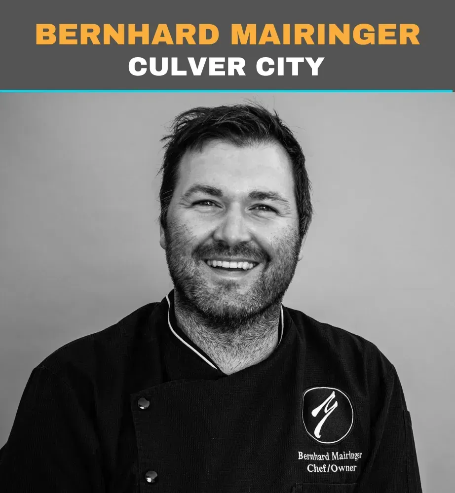 Headshot of Bernhard Mairinger smiling in a chef’s jacket, labeled Culver City.