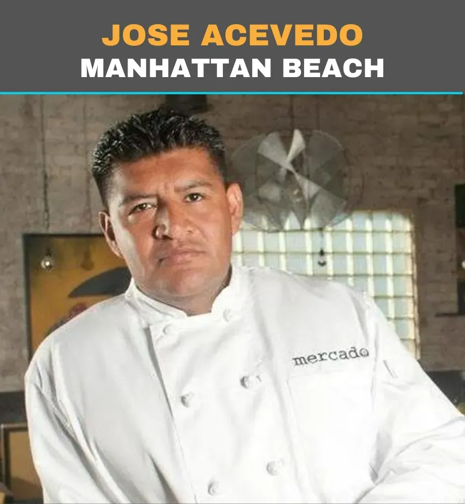 Chef Jose Acevedo at Manhattan Beach, in a white coat, standing in a kitchen.