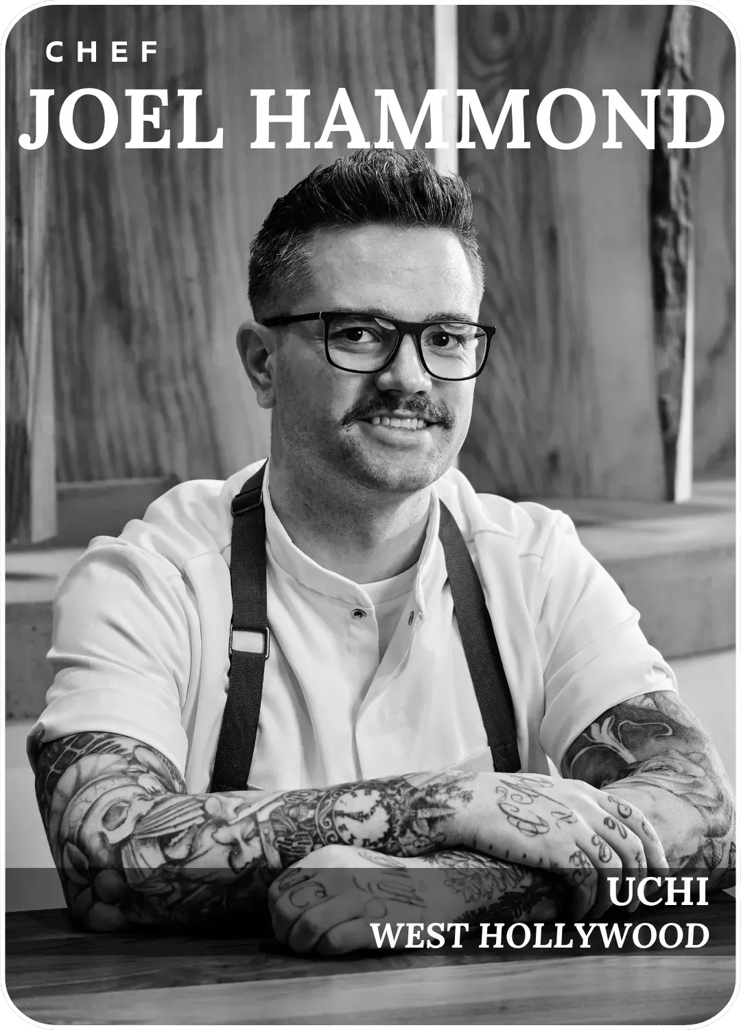 Chef Joel Hammond portrait, black-and-white, with arm tattoos, seated at Uchi West Hollywood.