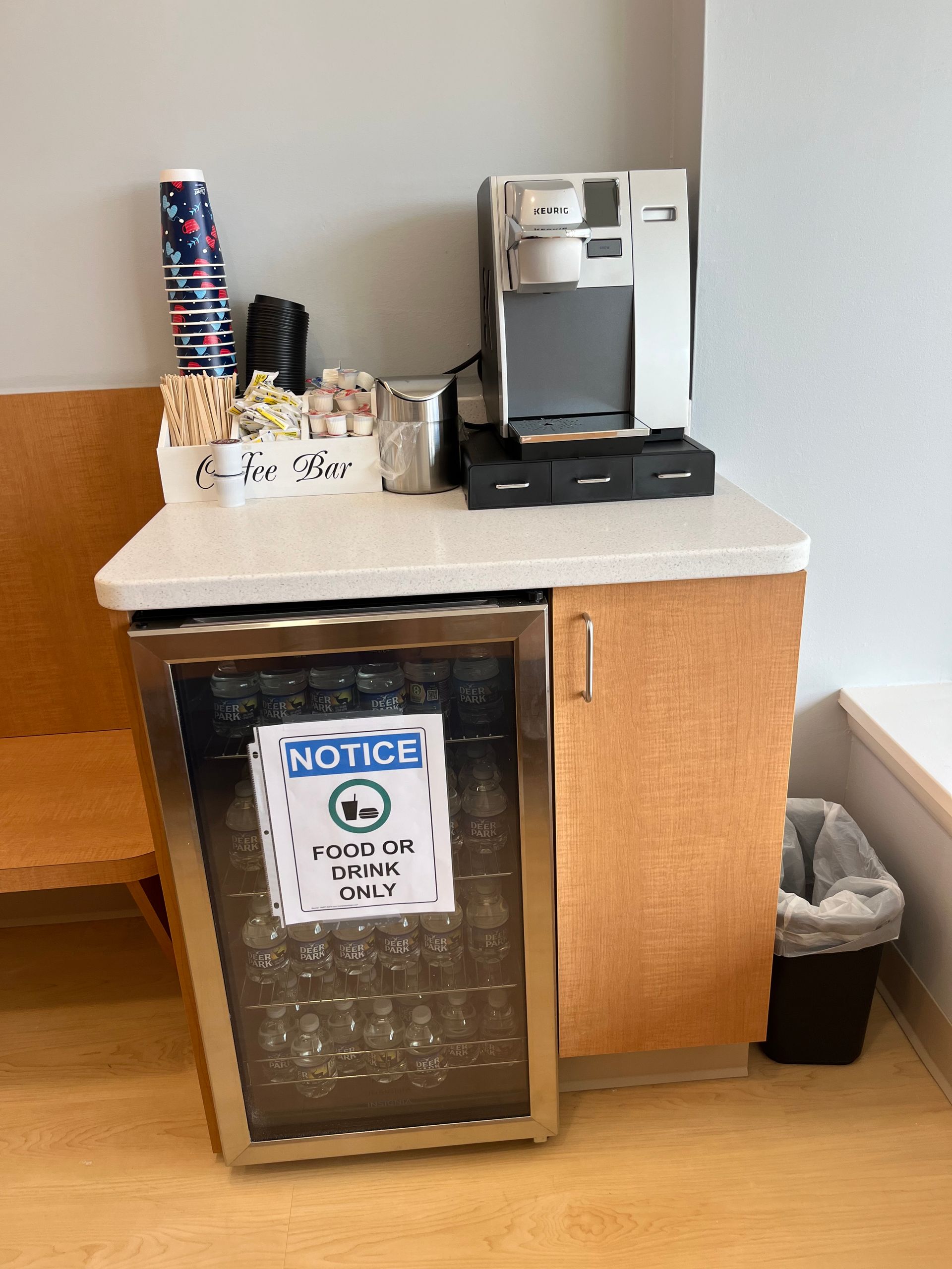 A small refrigerator with a sign on it that says notice.