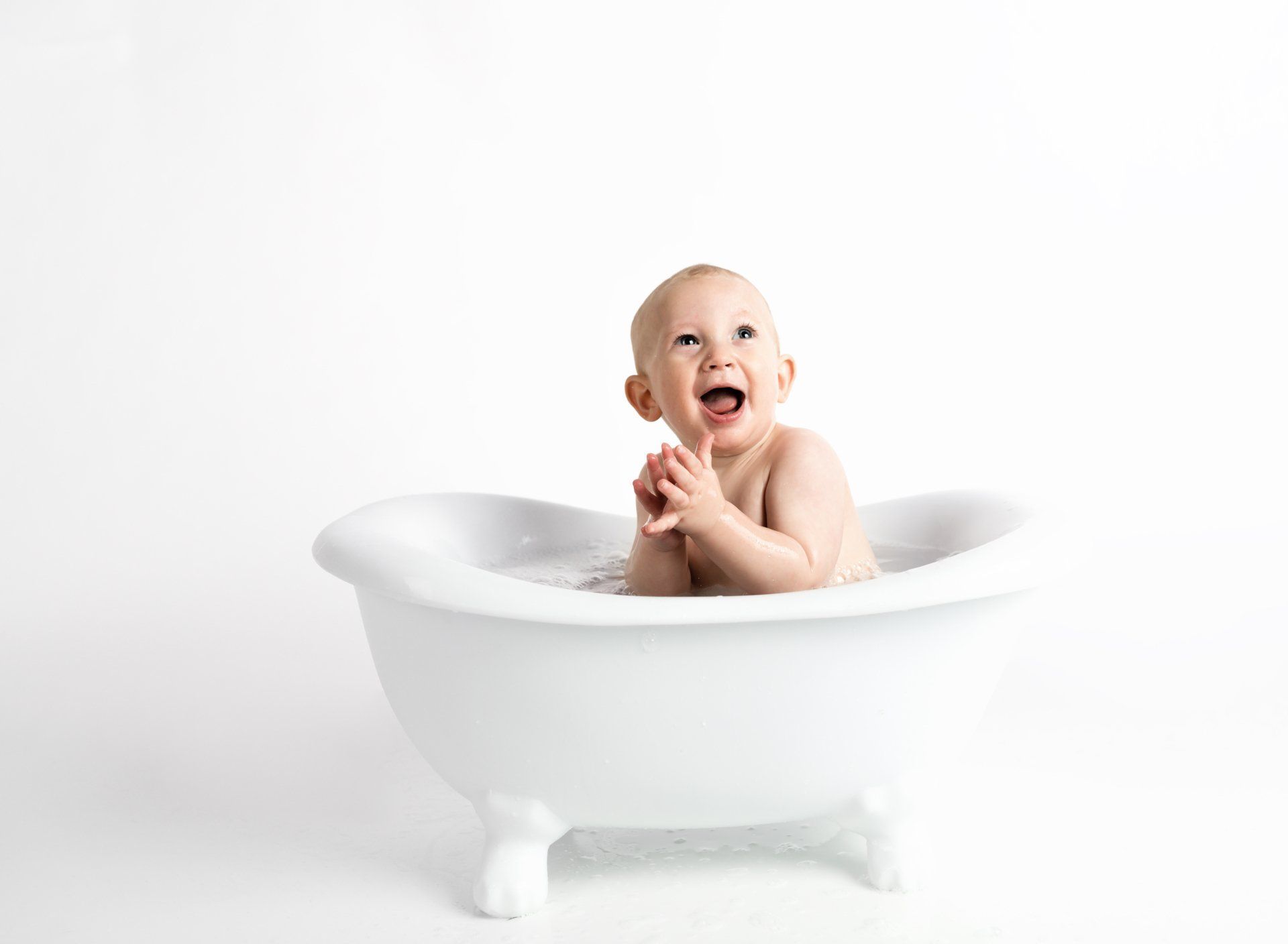 Happy baby smiling in tub | pediatric dentist in E Norriton PA