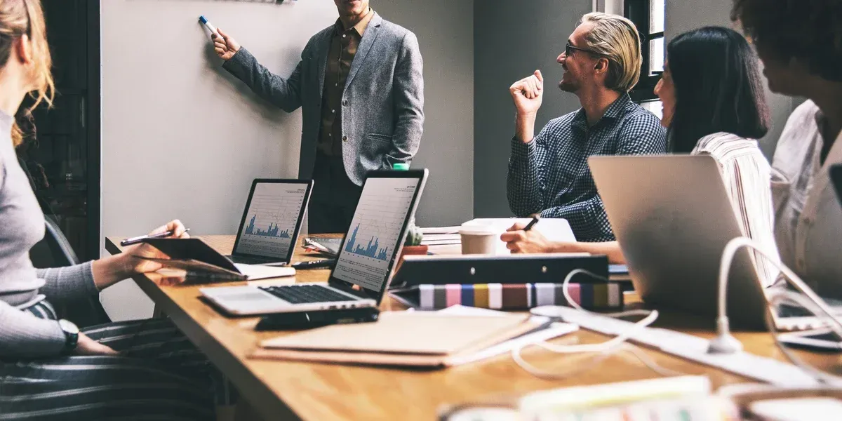 Business Team Meeting With a Presenter Pointing at a Whiteboard — Accountsloop Tax & Business Advisory in Geelong, VIC
