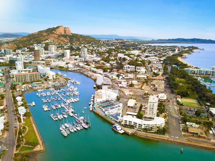 An Aerial View of a City With a Marina and Boats in the Water — Palms Vets–Hermit Park in Hermit Park, QLD
