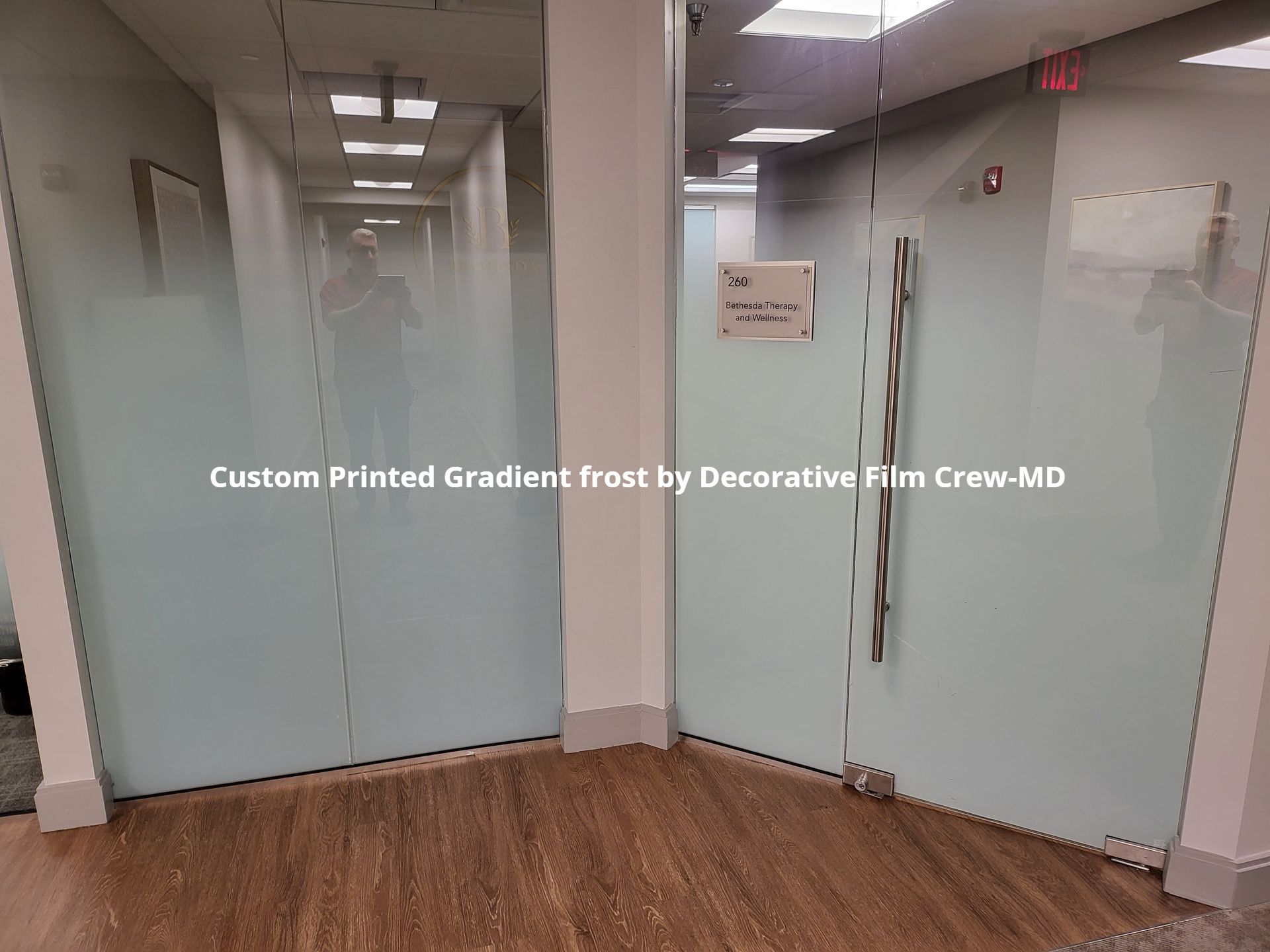 A hallway with a custom printed gradient frost by decorative film crew md