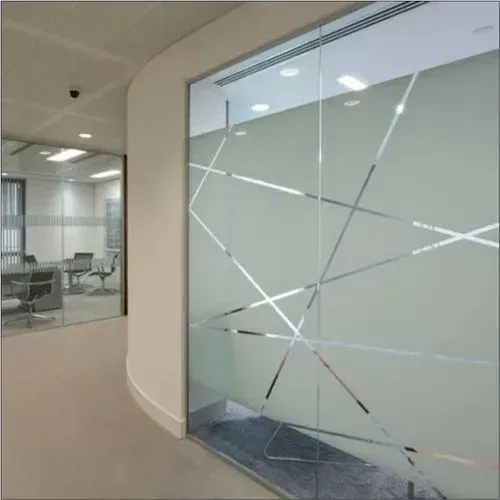 A building with a lot of windows and a reflection of trees in the windows.