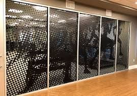 Open office glass partitions upgraded with privacy cloaking window film
