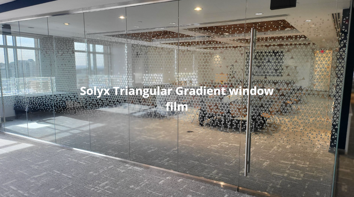 A large room with a lot of windows and a glass wall.