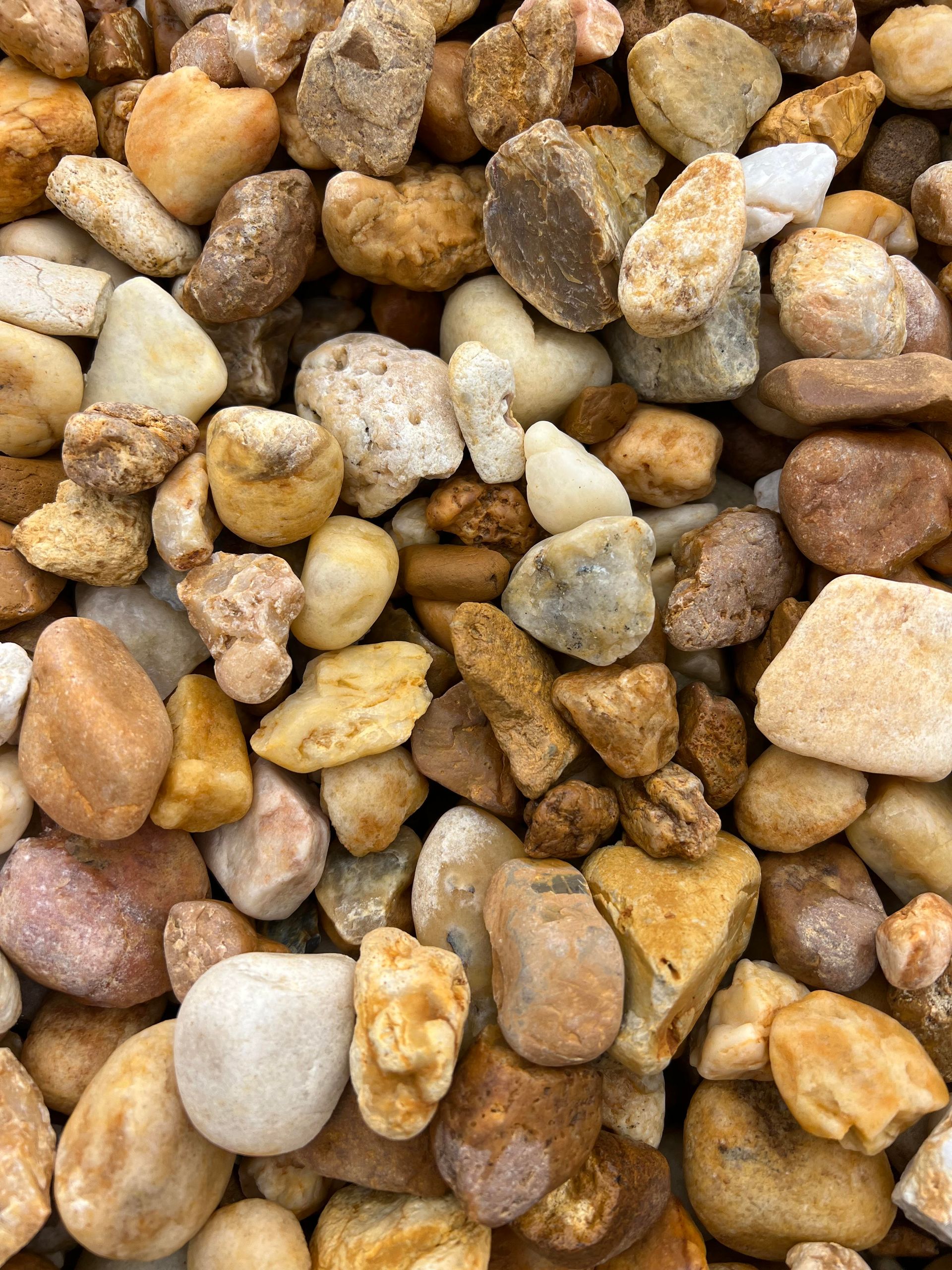 A pile of rocks of different sizes and colors.