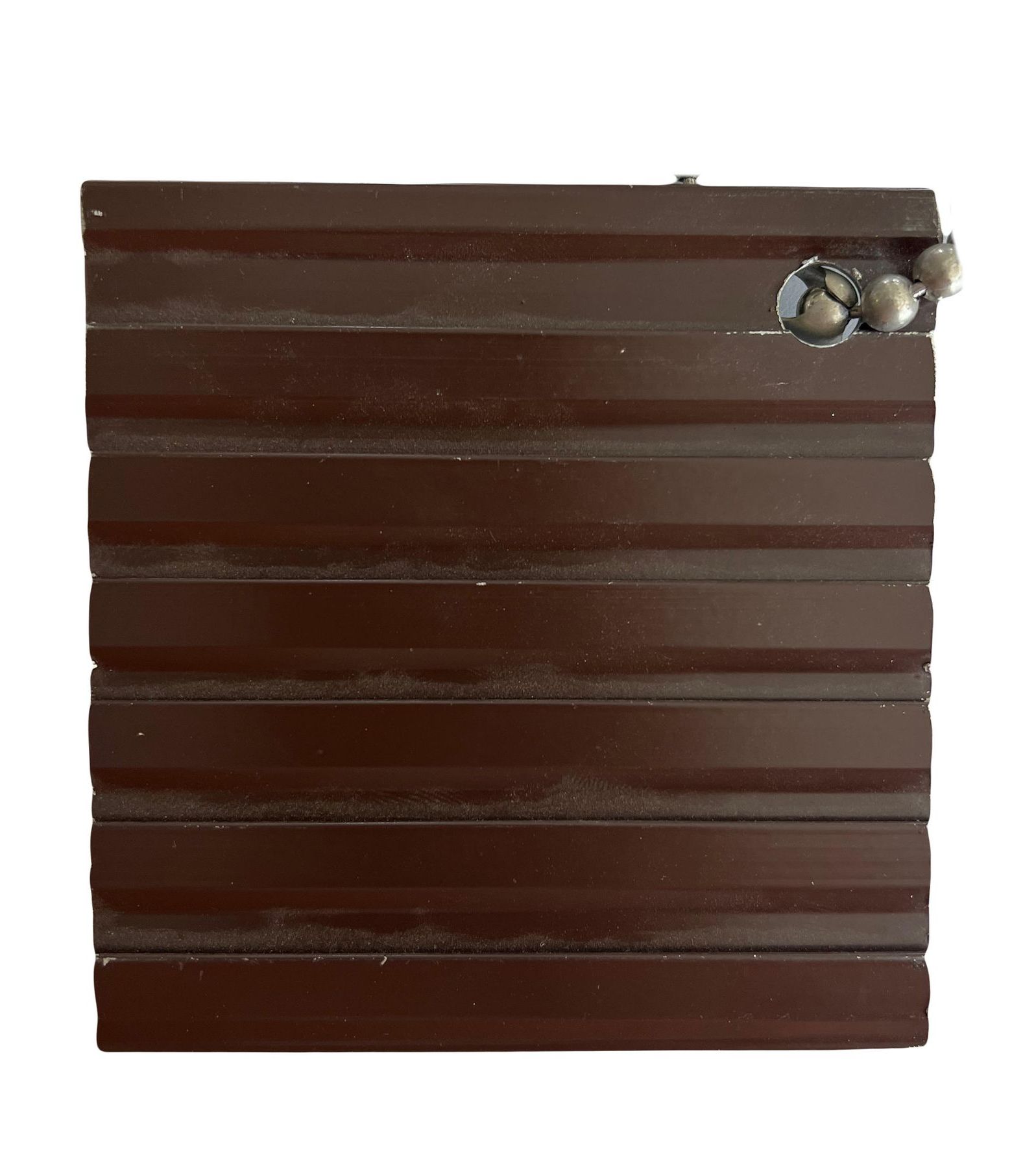 A close up of a piece of wood on a white background