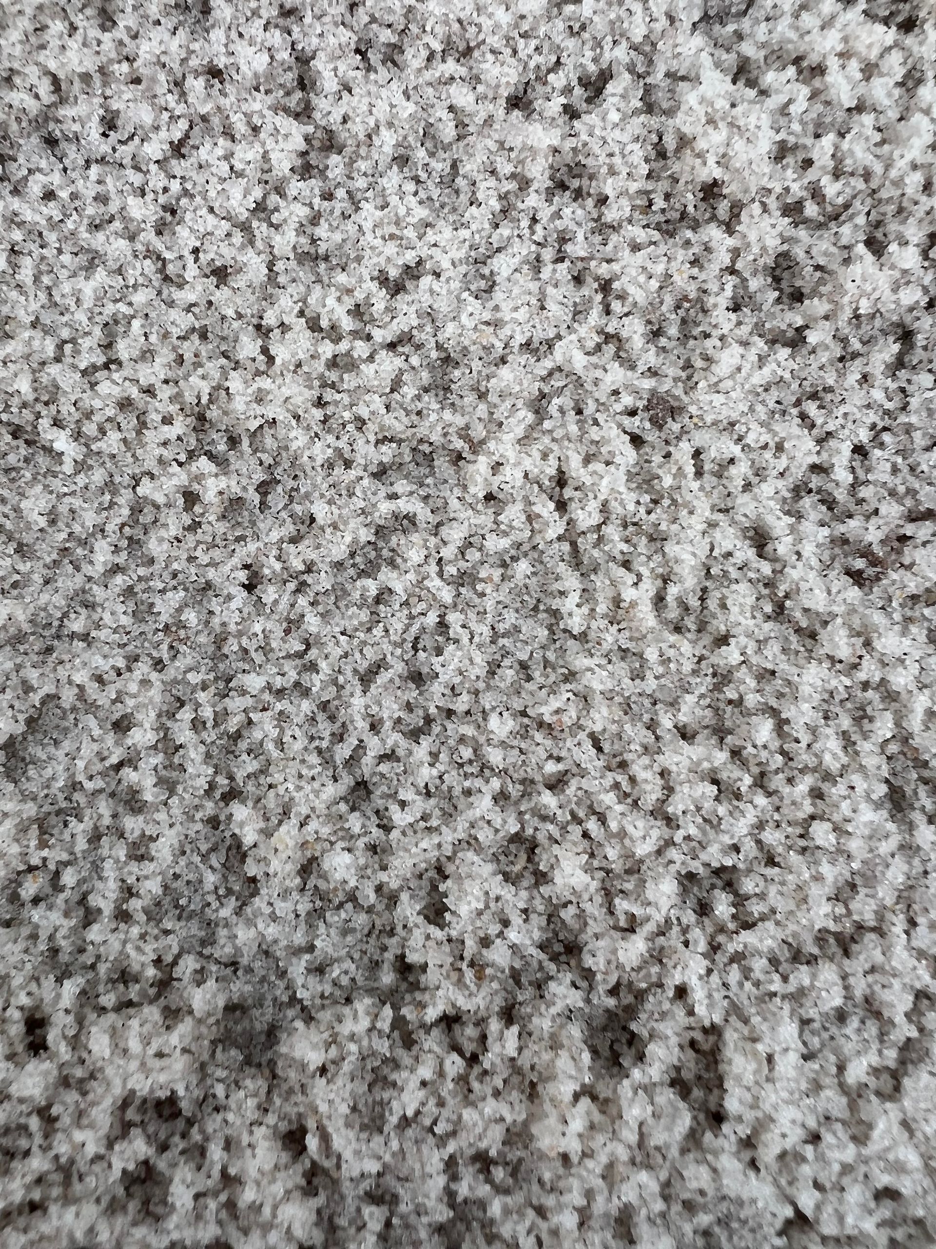 A close up of a pile of white sand.