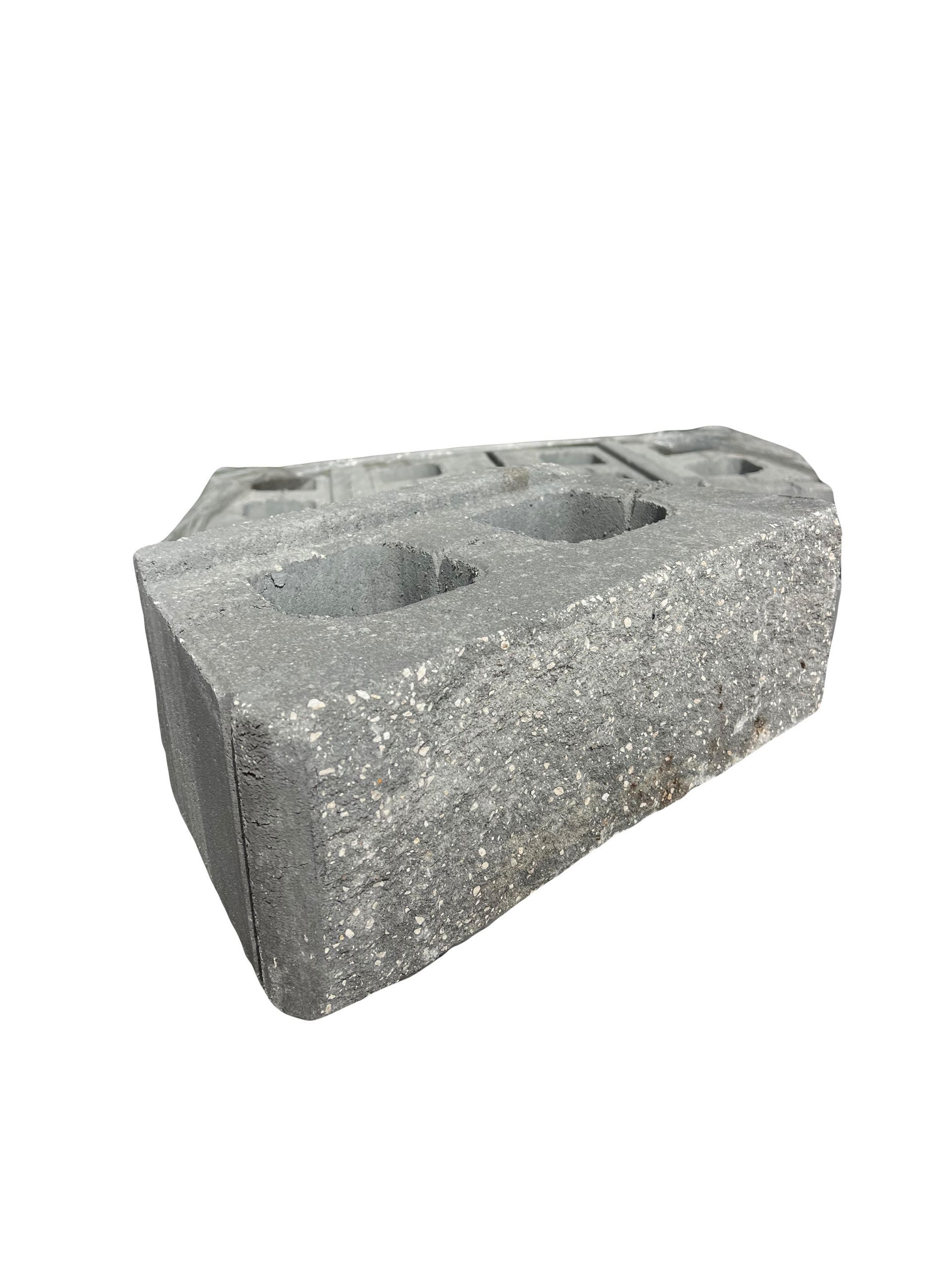 A close up of a concrete block on a white background.
