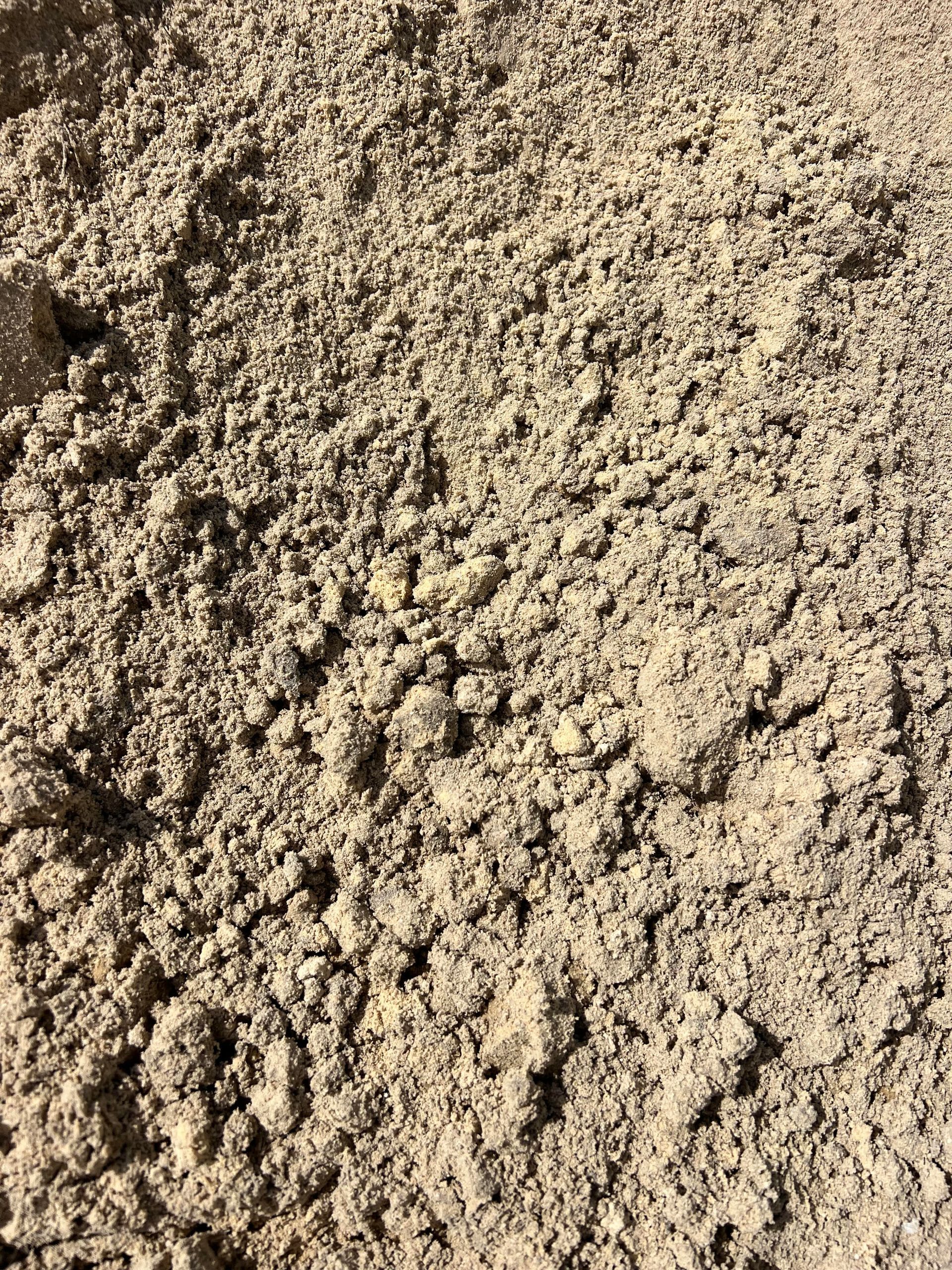 A close up of a pile of sand.