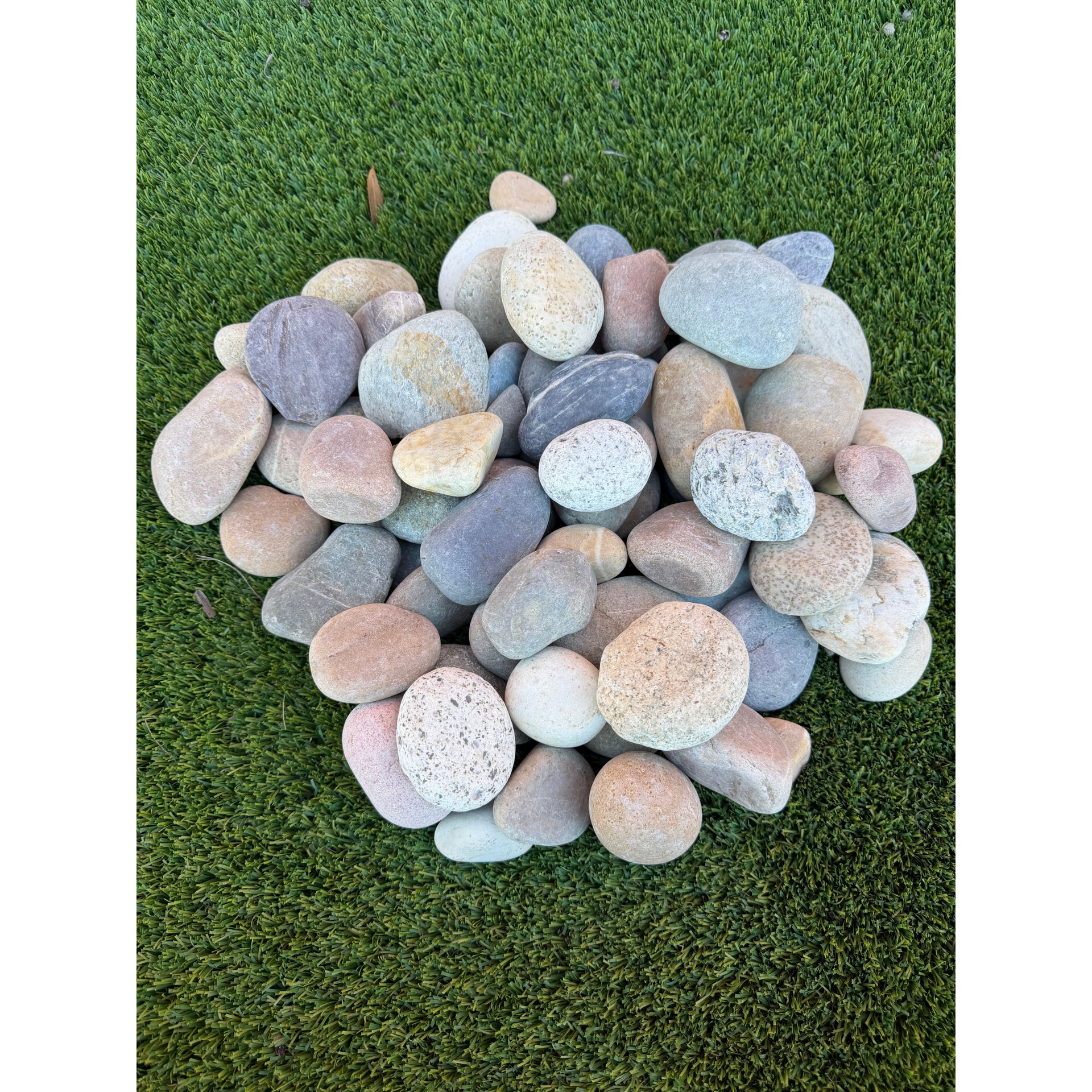 A pile of gray gravel is sitting on the ground.