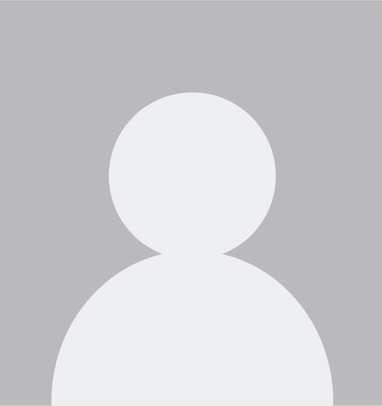 A silhouette of a person without a face on a gray background.