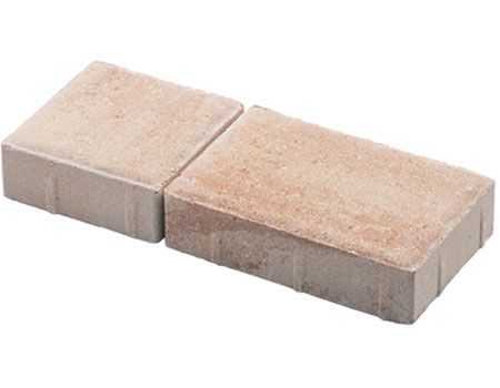 Two bricks are stacked on top of each other on a white background.