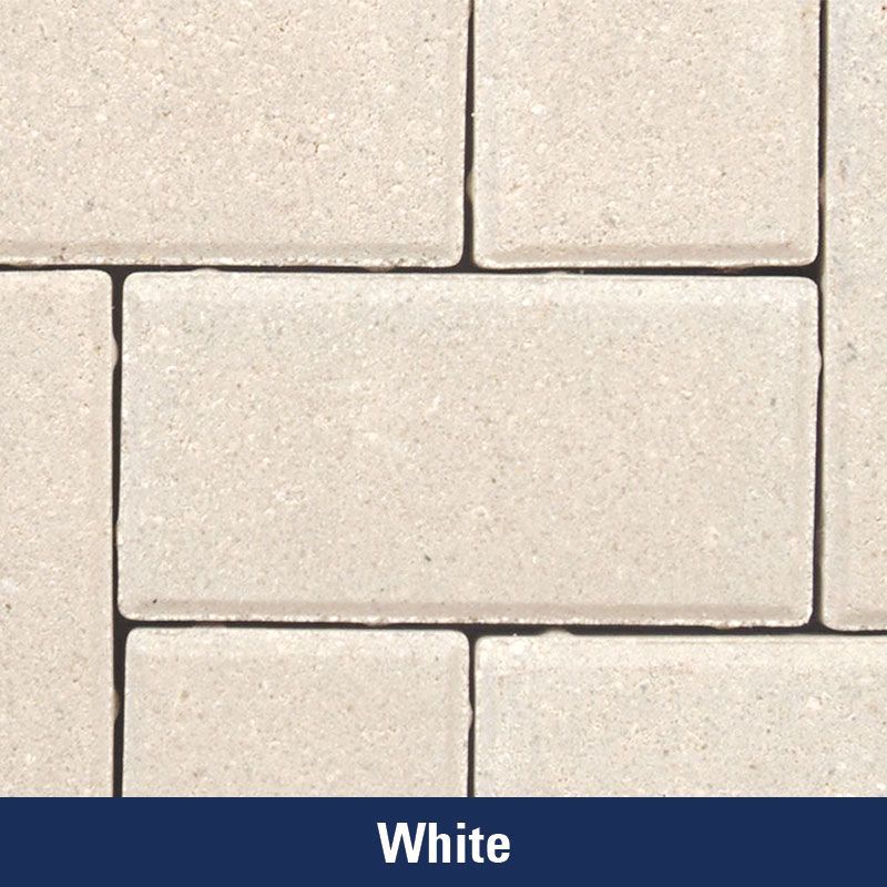 A close up of a white brick with the word white below it