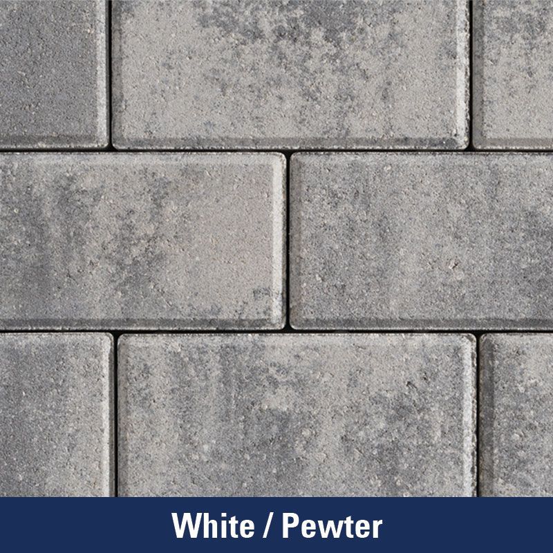 A close up of a white / pewter brick wall