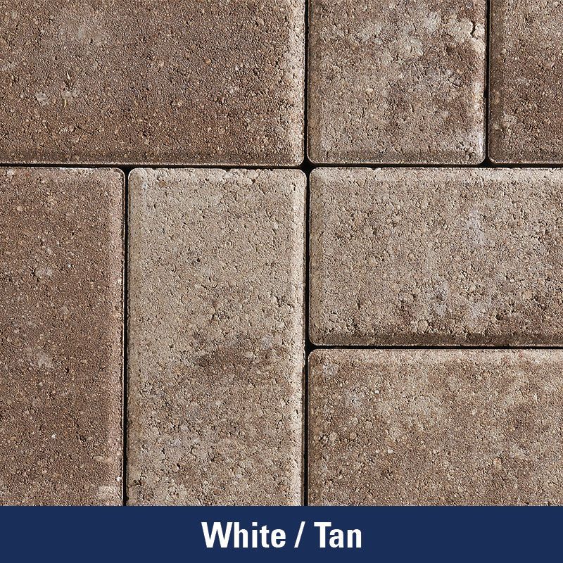 A close up of a white and tan brick wall
