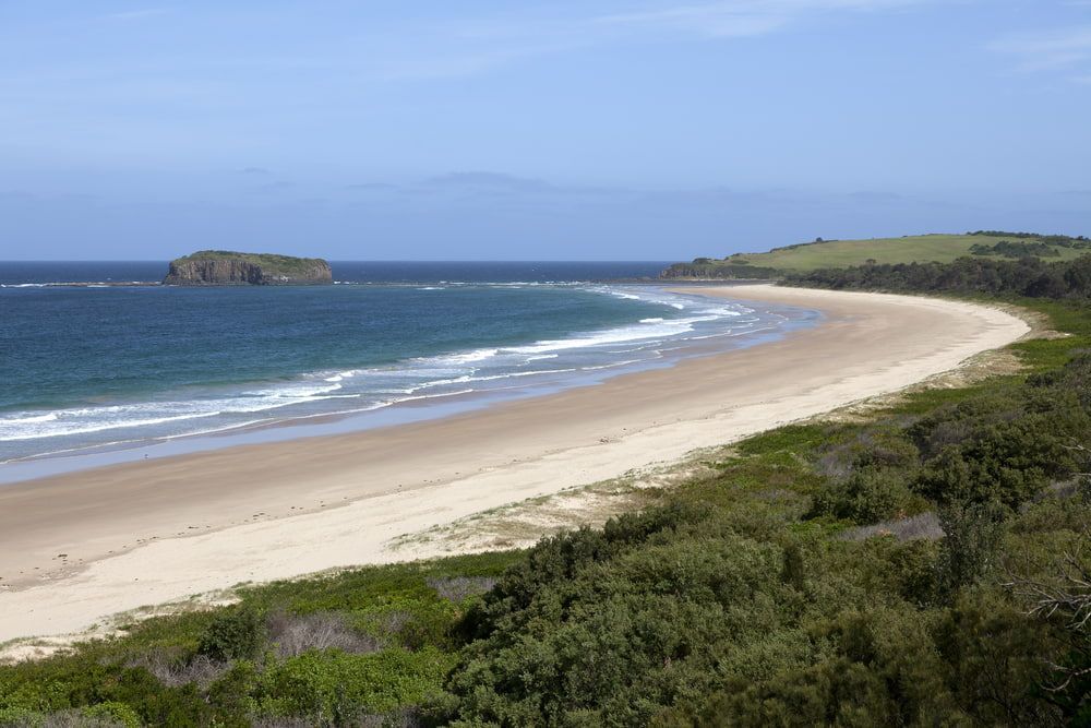 A Long Sandy Beach with A Small Island in The Distance — Illawarra Sign Group in Shellharbour, NSW