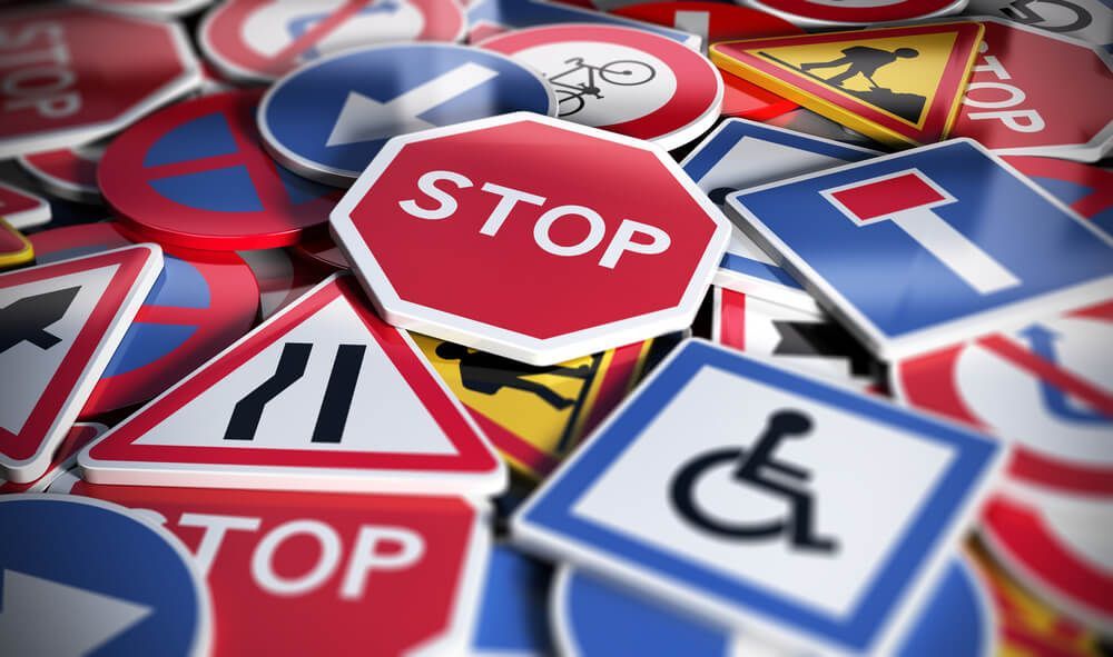 A Pile of Road Signs Including a Stop Sign — Illawarra Sign Group in Kiama, NSW