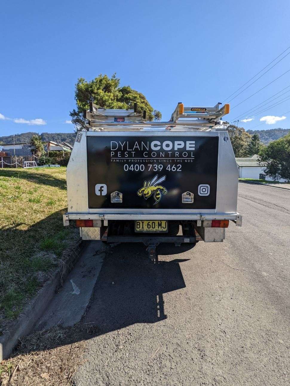 A Truck Is Parked on The Side of The Road — Illawarra Sign Group in Bulli, NSW