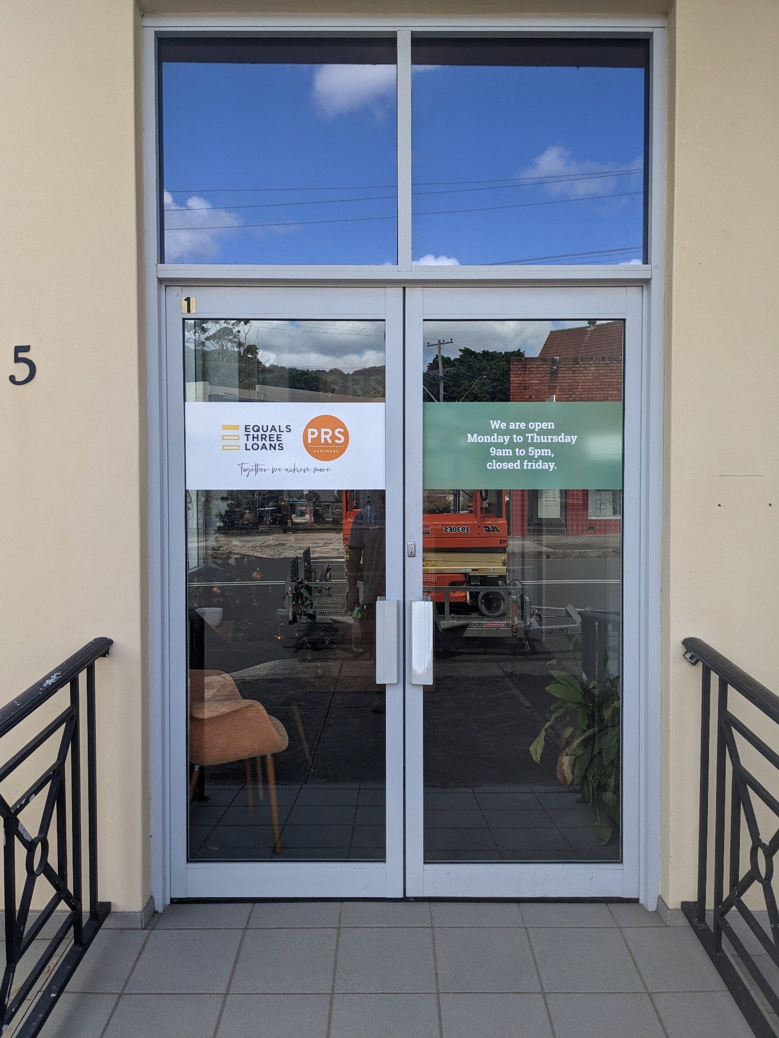 Sticker Banner on Glass Door — Illawarra Sign Group in Bulli, NSW