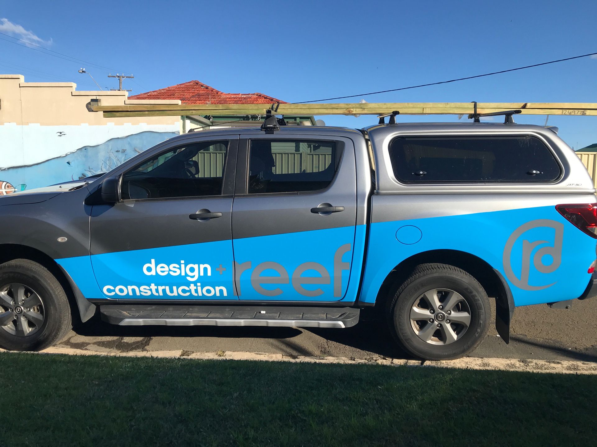 A Truck with The Word Design on The Side of It — Illawarra Sign Group in Bulli, NSW