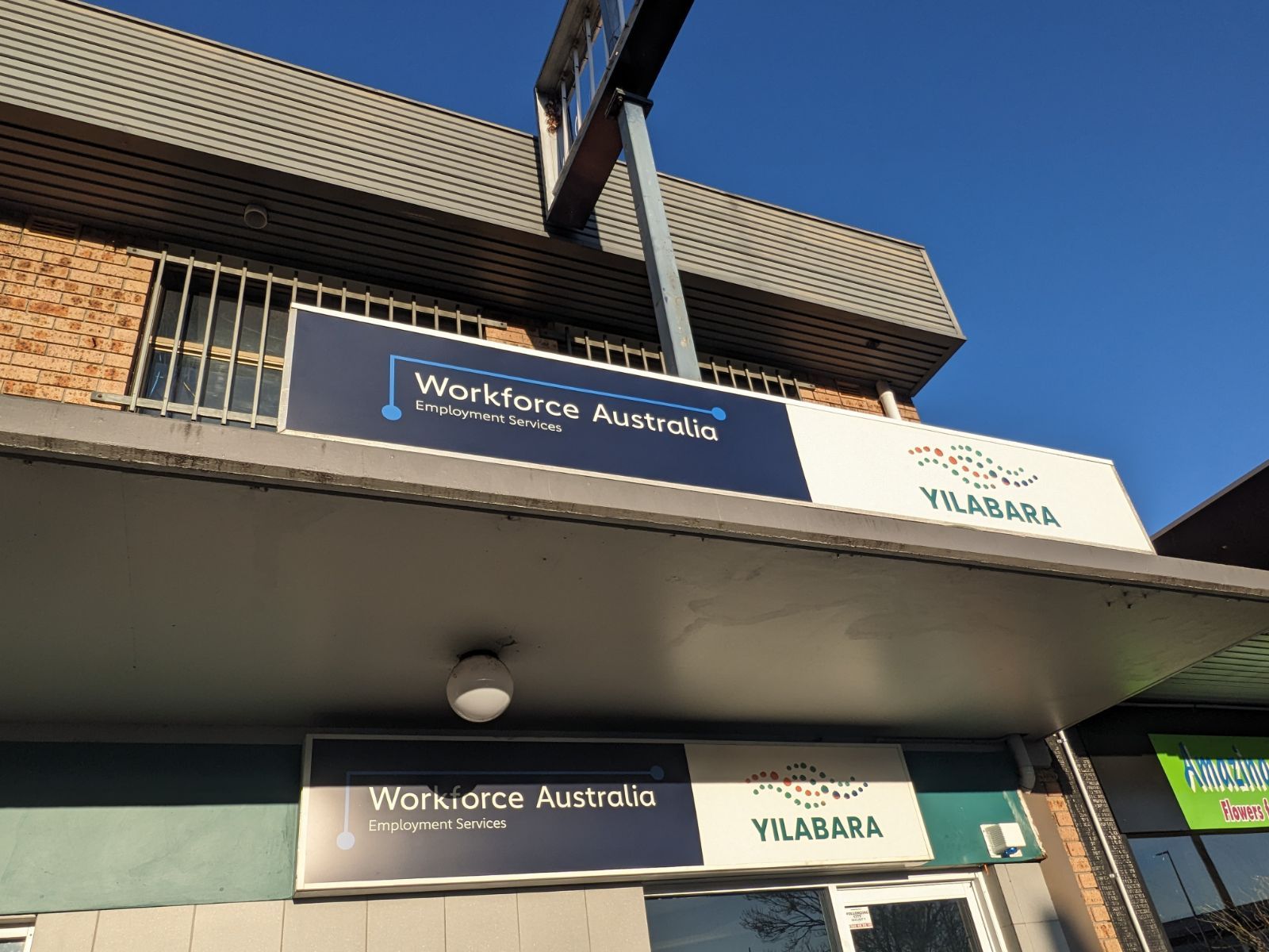 A Building with A Sign that Says Workforce Australia on It — Illawarra Sign Group in Bulli, NSW