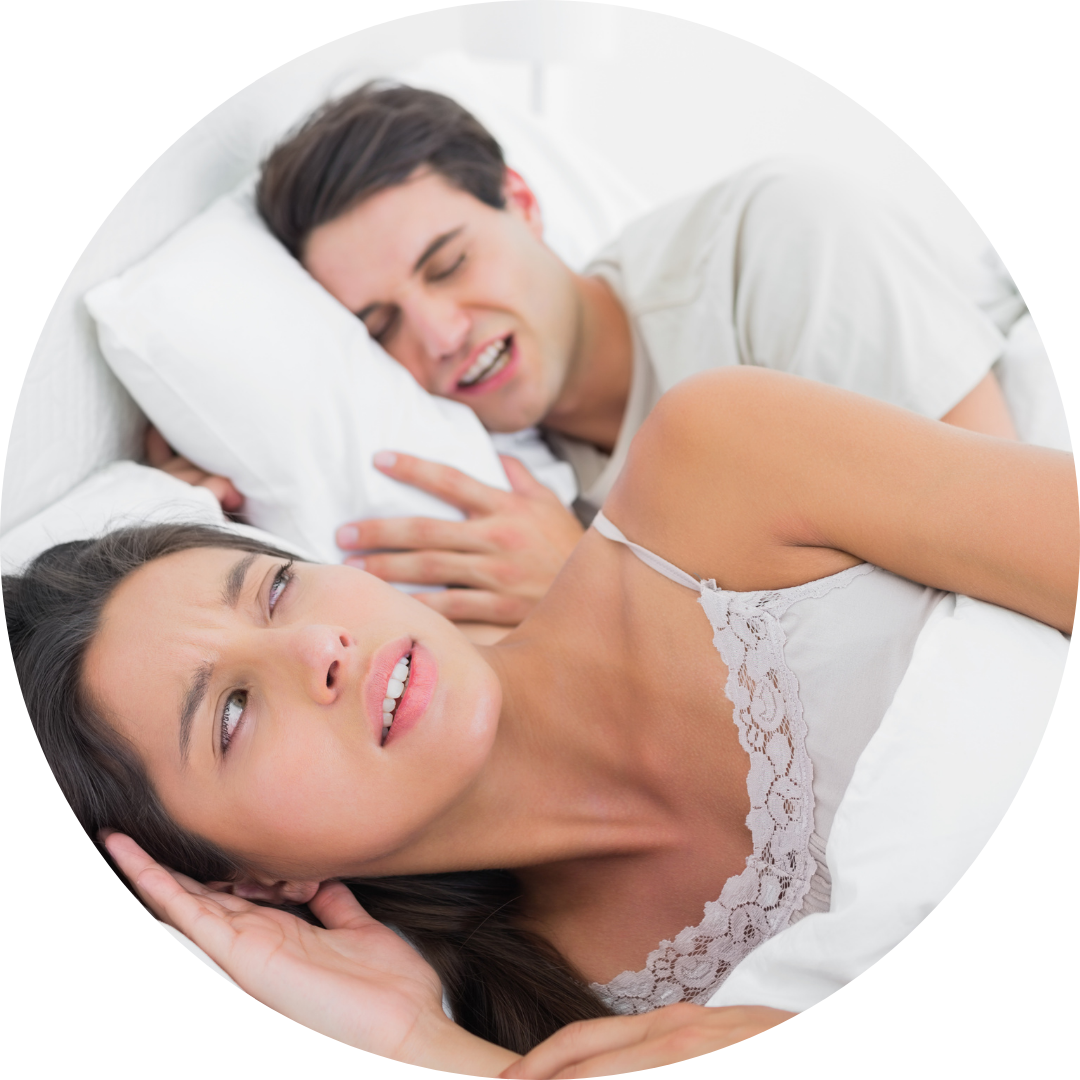 man and woman sleeping and man snoring.