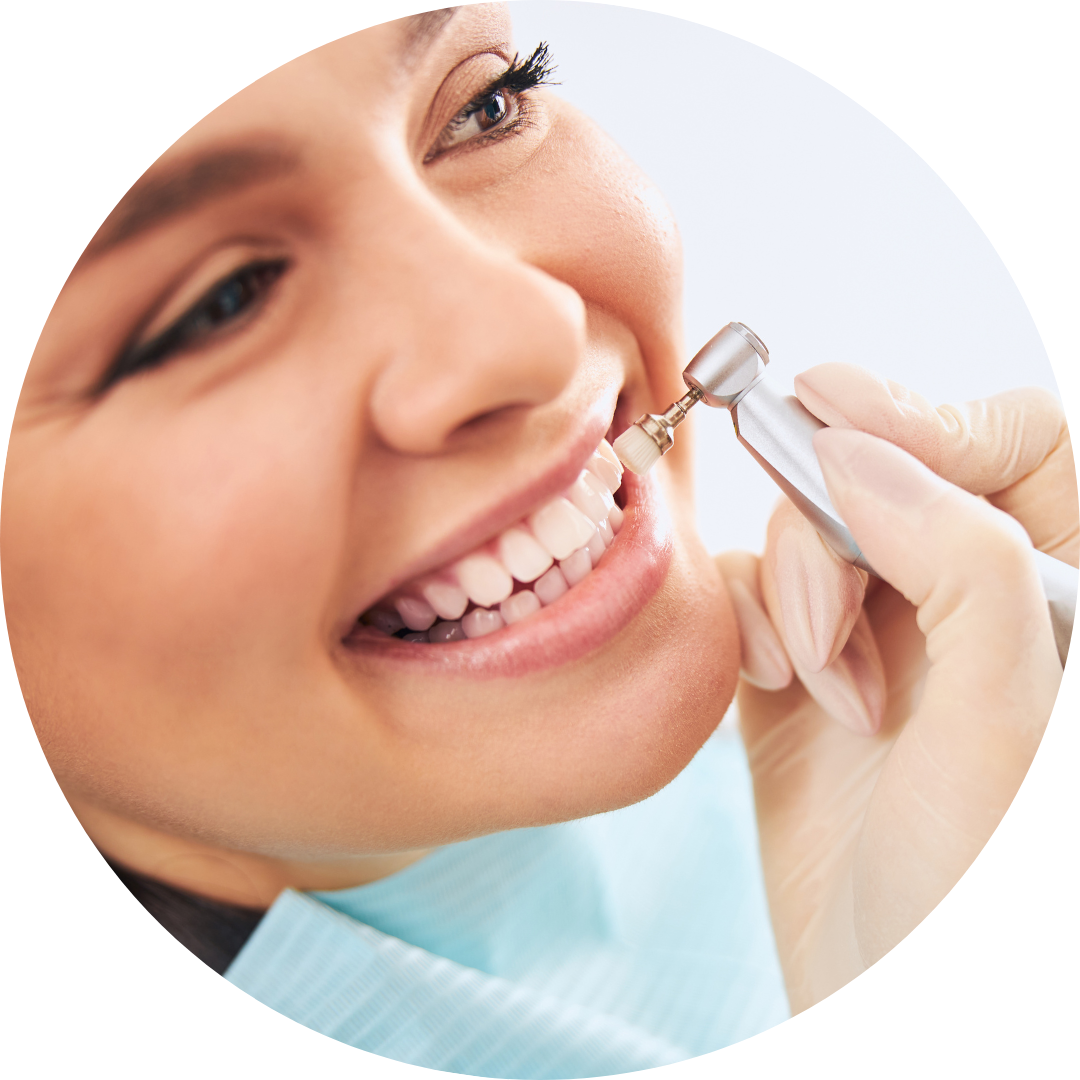 A woman is getting her teeth checked by a dentist