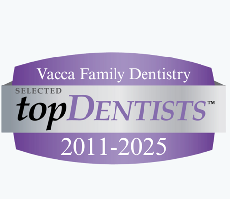 The logo for vacca family dentistry is purple and silver