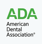 The logo for the american dental association is green and black.