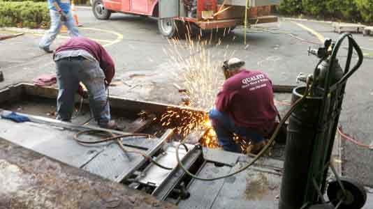 Welder working on warehouse Construction — Services in Piscataway, NJ