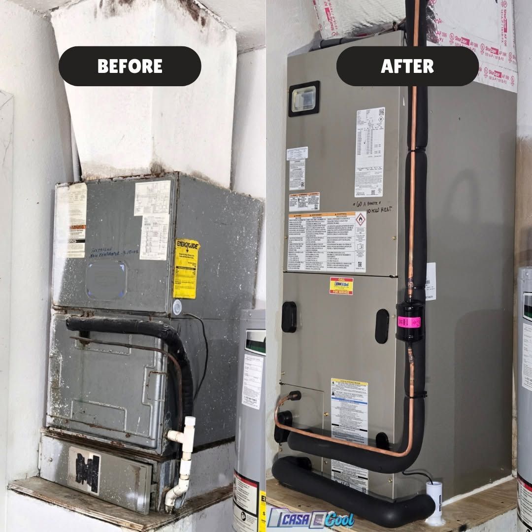 Outdoor air conditioner unit beside a house wall, with a fan grill and beige casing.