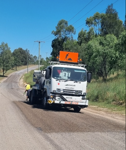 Bitumen sealing truck parked on a rural road ready for resurfacing – Hunter Valley Bitumen in Gresford, NSW.