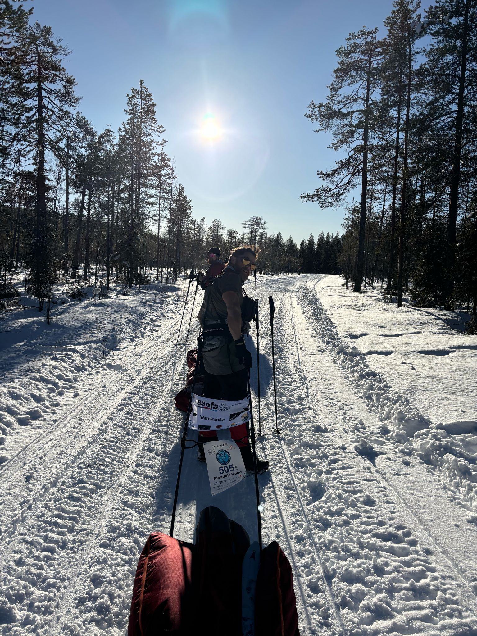A man in a suit and tie is standing in front of a good morning britain wall.